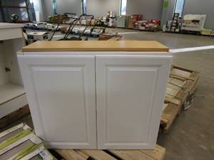 lot 202 image: HAMPTON BAY Hampton Satin White Raised Panel Stock Assembled Wall Kitchen Cabinet (36 in. x 30 in. x 12 in.) (CABINET DOOR CRACKED BEHIND HINGE, AND TOP CORNER SPLIT, SEE PHOTOS)