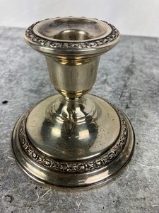 lot 90 image: Pair of Weighted Sterling Silver Candlesticks- Frank Whiting Talisman Rose