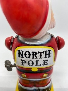 lot 98 image: Vintage Bandai Toys SantaSkier Tin Litho Wind Up Toy - Japan
