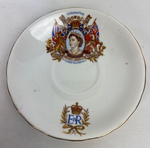 lot 129 image: Queen Elizabeth June 2, 1953 Coronation Day Saucer and Royal Doulton Winston Churchill Toby Mug