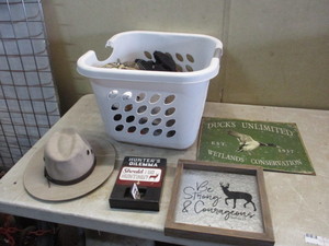 lot 83 image: Tote of hunting hats and signs