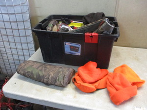 lot 85 image: Tote of gun and hunting stuff