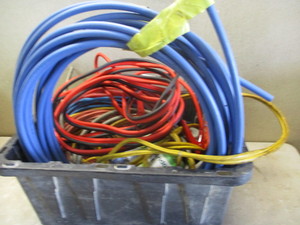 lot 108 image: Tote of Hose, cables, and tools
