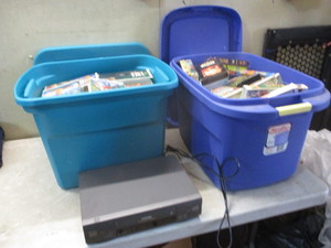 lot 148 image: 2 totes of VHS tapes and player