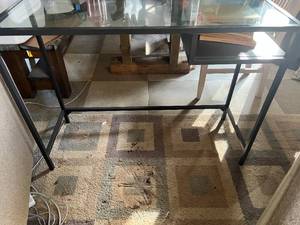Metal and Glass SofaEntry Table and Stack of Books