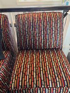 2 Armless Multi-colored Chairs with Throw Pillows