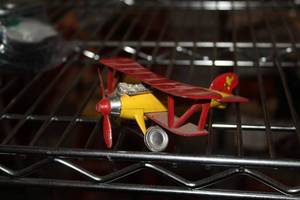 lot 611 image: Vintage Snoopy Biplane Toy