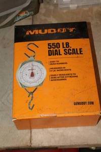 lot 670 image: Muddy 550-lb Dial Scale (in original packaging)