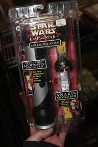 lot 705 image: Star Wars Episode 1 Anakin Skywalker Collector Watch with Lightsaber Display (in original packaging)