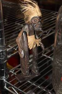 lot 740 image: Man with Surfboard Carved Wooden Table Statue