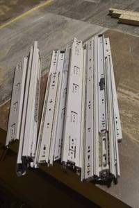 lot 45 image: various white drawer slides