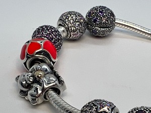 lot 34 image: Beautiful Pandora Sterling Bracelet with Charms