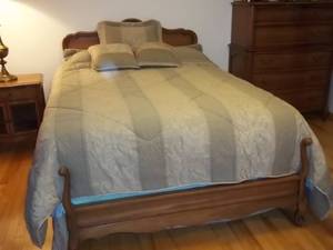 lot 2 image: Bedroom set including bed, 2 dressers, 2 end tables, bedding and more