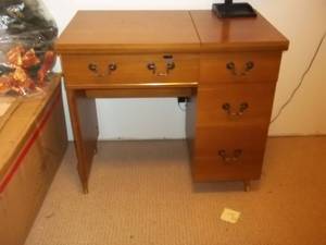 lot 151 image: Vintage sewing machine shell.