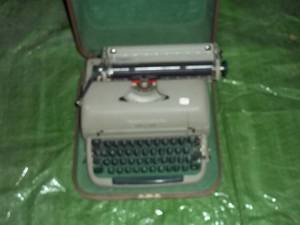 lot 326 image: Vintage typewriter in case...