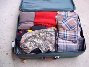 lot 358 image: Suitcase filled with outdoor clothe...