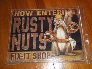 lot 541 image: Tin humor sign for the garage, man ...