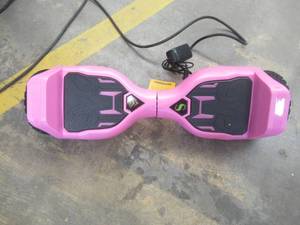 lot 603 image: Swagtron Warrior T580 Hoverboard, 220 lb Weight Limit, Pink, Music-Synced Bluetooth LED Lights, 7.5 Mph LiFePo Battery - Battery Does Not Hold A Charge - SOLD AS IS