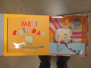 lot 624 image: (6) Meet Birthday Book and Plush Doll  - SOLD AS IS