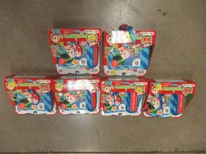 lot 626 image: (6) CoComelon Official Musical Plush Book, Fun Day At School  - SOLD AS IS