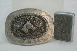lot 350 image: Intricate Horse Belt Buckle & Ford Zippo