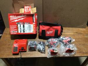 lot 100 image: MilwaukeeM18 18V Lithium-Ion Brushless Cordless Compact DrillImpact Combo Kit (2-Tool) W (2) 2.0Ah Batteries, Charger & Bag  Review all pictures - Customer Return