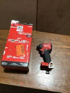lot 33 image: Milwaukee Drill Milwaukee M18 FUEL 18V Lithium-Ion Brushless Cordless 14 in. Hex Impact Driver (Tool-Only) Costumer Returns see Pic