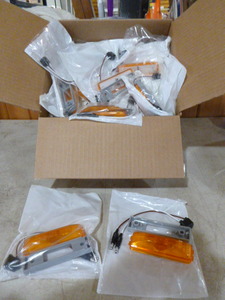 lot 80 image: Case of Peterson Manufacturing Amber Marker Lights