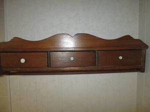Vintage wooden wall shelf with beve...