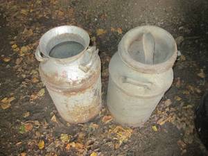 (2)Antique Milk cans. One contains ...