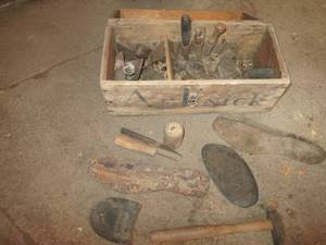Antique wood toolbox full of assort...