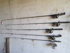 Lot of (5) long Fishing rods and re...