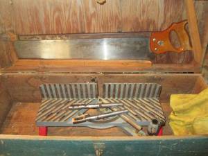 Large antique wooden toolbox with a...
