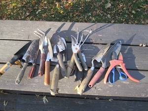 Variety of garden shovels hand rake...
