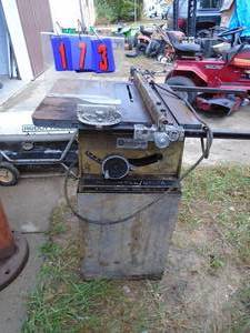 lot 173 image: RockwellDelta cast iron bed table saw with miter & fence. Tested & works. As shown.