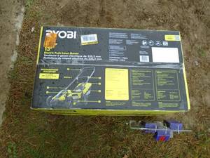 lot 181 image: Ryobi 110 volt lawn mower with bagger. Appears to have been used once. Tested & works. As shown.
