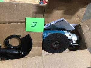 lot 5 image: Makita 15 Amp 7 in. Corded Angle Grinder with Grinding wheel, Side handle and Wheel Guard  Customer Returns See Terms on Auction
