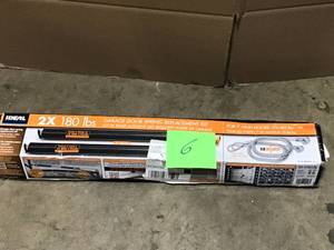 lot 6 image: 180 lbs. Gold or Orange Garage Door Extension Spring with Safety Cables (2-Pack) by IDEAL SECURITY  Customer Returns See Terms on Auction