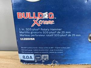 lot 79A image: Brand New Bosch Bulldog Xtreme 8 Amp 1 in. Corded Variable Speed SDS-Plus ConcreteMasonry Rotary Hammer Drill with Carrying Case 