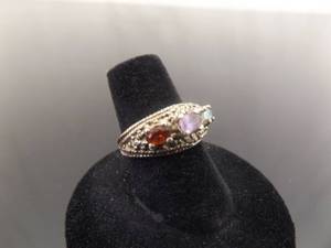 lot 49 image: .925 Sterling Silver Garnet, Amethyst, and Topaz Ring Size 6.75