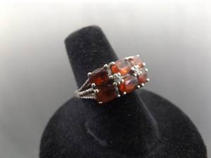 lot 57 image: .925 Sterling Silver Oval Cut Garnet Ring Size 6.5