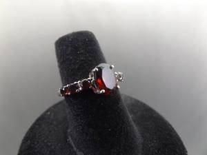 lot 58 image: .925 Sterling Silver Oval Cut Garnet Crystal Ring Size 5.75