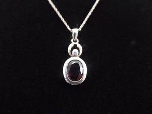 lot 9 image: .925 Sterling Silver Oval Cut Deep Red Garnet Pendant Necklace