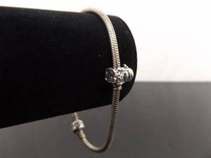 lot 29 image: .925 Sterling Silver PANDORA ALE Bracelet w1 Charm
