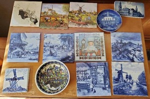 Collection Of Coasters, Tiles, And Plates