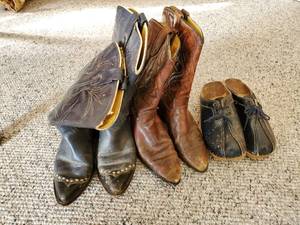 Two Pairs Of Boots And A Pair Of Clogs