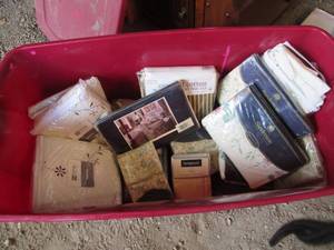 Large covered storage tote filled w...