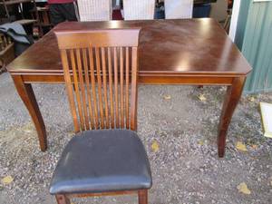 Darker tone Wooden 60 dining table...