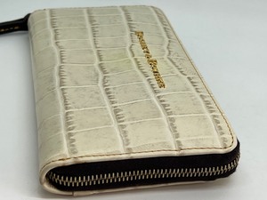 lot 113 image: Dooney and Bourke Ivory Wallet