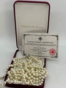 lot 106 image: Camrose and Kross JBK Triple Strand Simulated Pearls